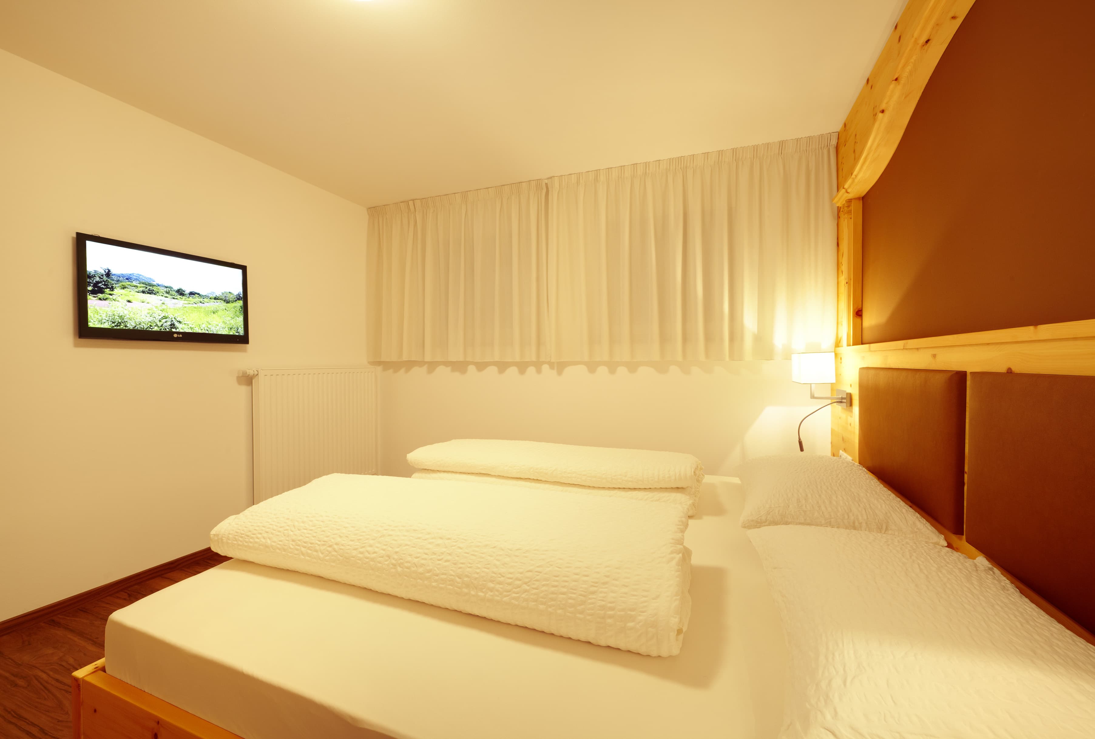 Vacanza Appartemento Residence Lechner camera da letto TV